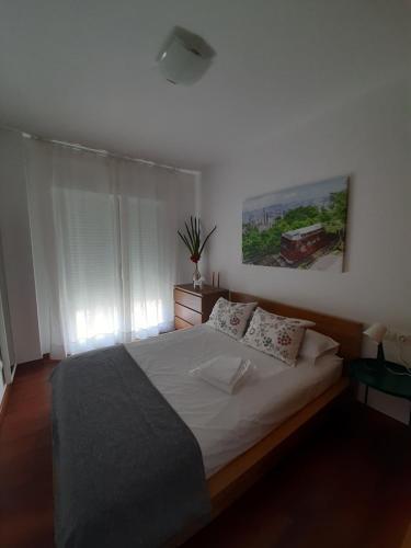 A bed or beds in a room at Dunas de Corrubedo