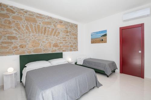 מיטה או מיטות בחדר ב-La Rocchetta