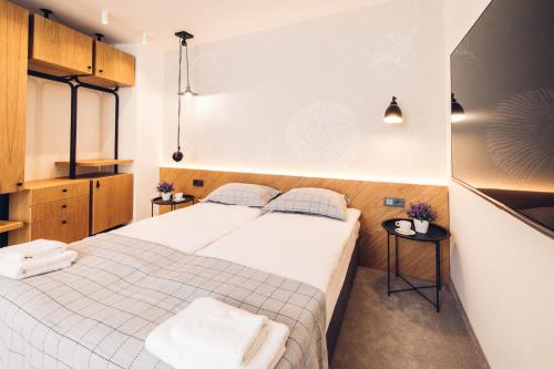 Кровать или кровати в номере Antares City Sozopol