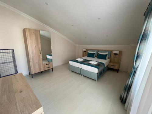 Ένα ή περισσότερα κρεβάτια σε δωμάτιο στο Alfa Apart Hotel
