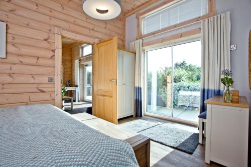 מיטה או מיטות בחדר ב-Cutterbrough, Great Field Lodges