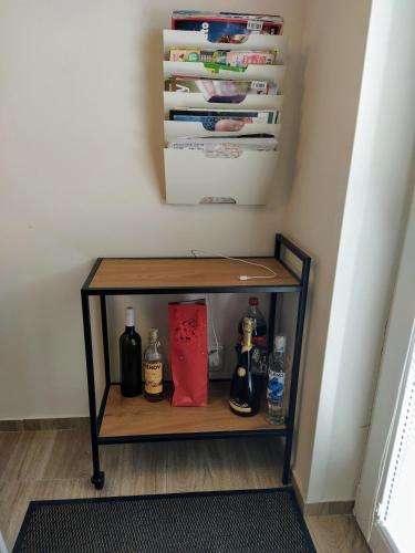 a shelf in a room with bottles on it at Chata Ondrášek in Bedřichov