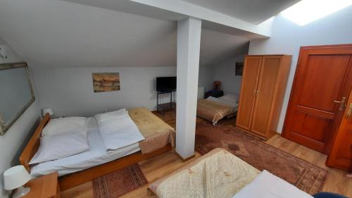 Ένα ή περισσότερα κρεβάτια σε δωμάτιο στο HOTELOWE Pokoje J.Bukowiecka
