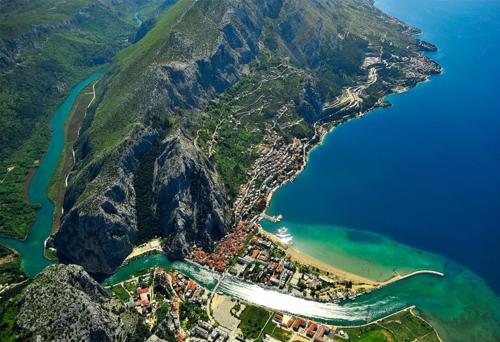 an aerial view of a mountain with a body of water at Apartments Mirko in Mimice