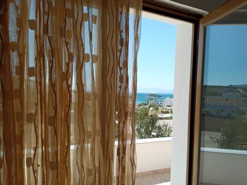 a window with a view of the ocean at Vila Jeti in Ksamil