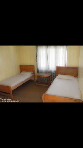 Krevet ili kreveti u jedinici u okviru objekta State Continental Hotel