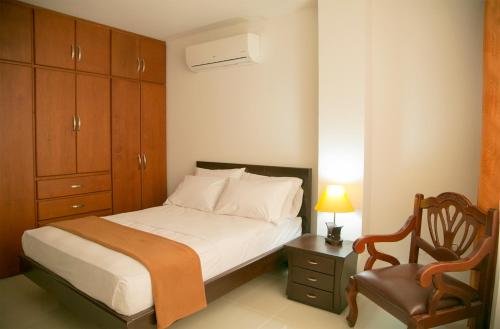 เตียงในห้องที่ Hotel Casimena