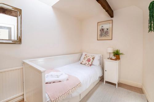 Postel nebo postele na pokoji v ubytování Cavalier Cottage