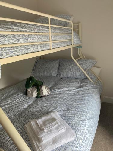 a stuffed animal sitting on top of a bunk bed at Traditional Farm House in the Old Head of Kinsale in Cork