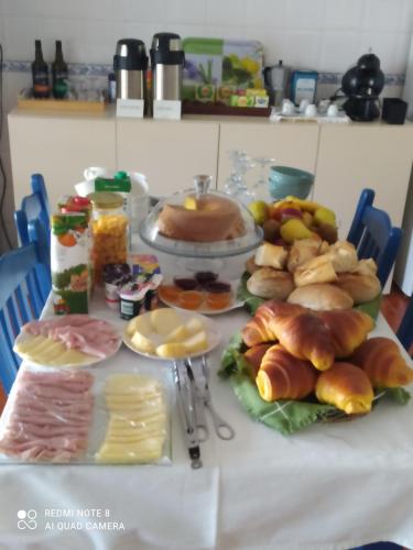 a table topped with lots of different types of food at Quinta dos Avós in Viana do Castelo