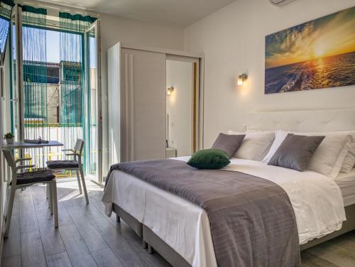 Postel nebo postele na pokoji v ubytování SmartMini Apartments