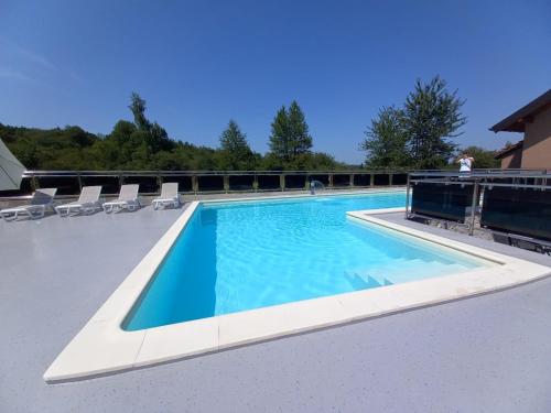 a swimming pool on the roof of a house at Rooms Villa Ruja in Grabovac