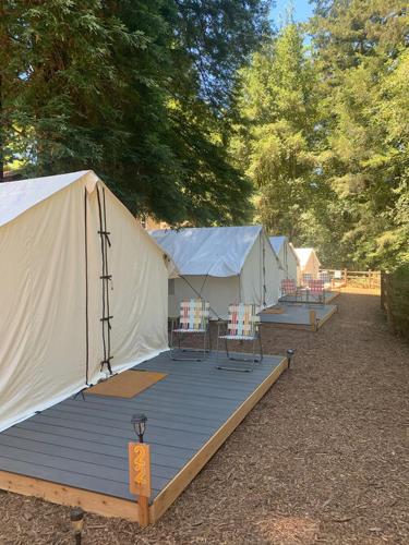 a group of tents with tables and chairs on a deck at Highlands Resort - Adults Only in Guerneville