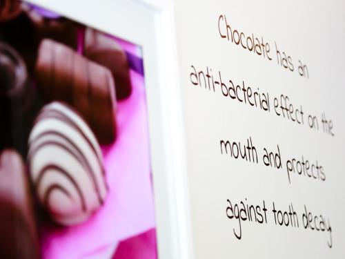 a close up of a book with a chocolate test at The Chocolate Box Hotel in Bournemouth