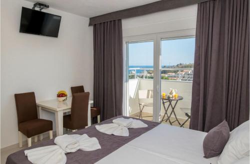 a hotel room with a bed and a balcony at Apartmani Nela Sutomore in Sutomore