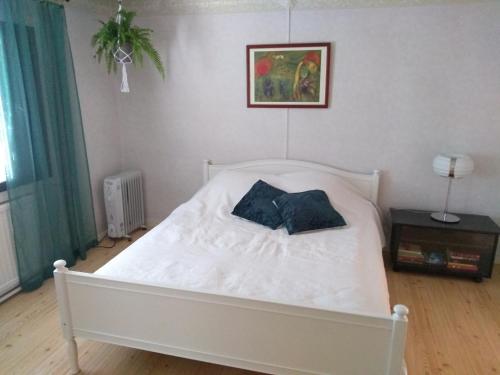 En eller flere senge i et værelse på Oliveira Guesthouse