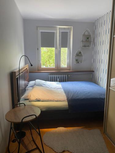 Posteľ alebo postele v izbe v ubytovaní Apartament Martyna