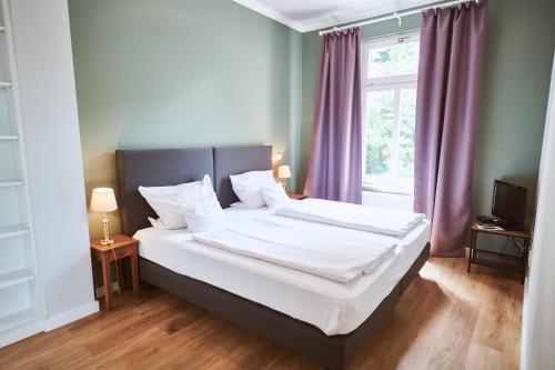 Katil atau katil-katil dalam bilik di Gutshotel Baron Knyphausen