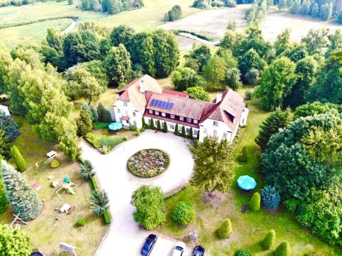 an aerial view of a large house with a garden at Pałac Wojciechy in Wojciechy