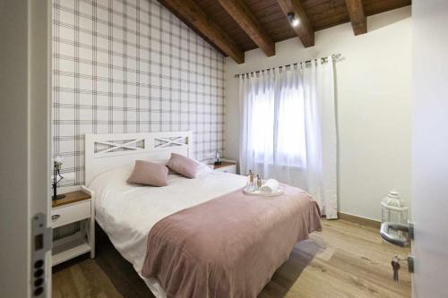 A bed or beds in a room at Casa Juliana Turismo