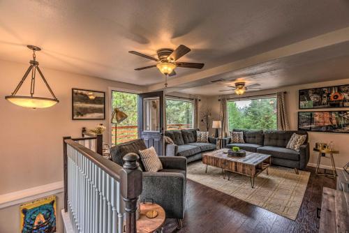a living room with a couch and a table at On the Rocks - A Modern Home with Decks and Views in Cloudcroft