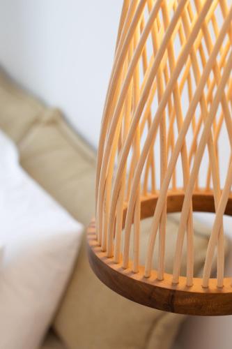 a close up of a wooden rocking chair at Due Mari Mykonos in Agios Ioannis Mykonos