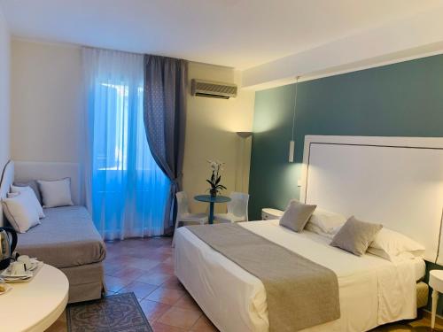 Cama o camas de una habitación en Hotel Posta