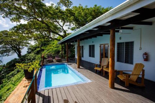 a deck with a swimming pool on a house at Daku Resort in Savusavu