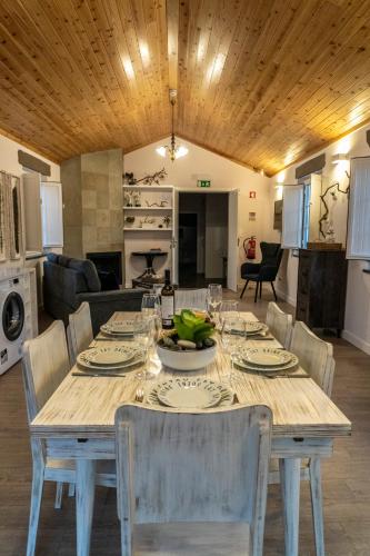 a dining room table with a bowl of fruit on it at Penthouse Peaks - Casa Sao Joao -4 Star Tourist Apartments in Angra do Heroísmo