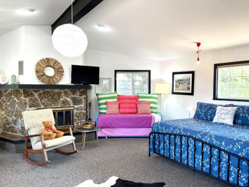 a living room with a bed and a couch at Chalet Inn in Whitefish