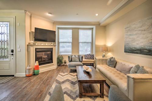 a living room with a couch and a fireplace at Sunny San Diego Escape Less Than 2 Miles to Pacific Beach! in San Diego