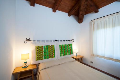 Ένα ή περισσότερα κρεβάτια σε δωμάτιο στο Residence Approdo Verde