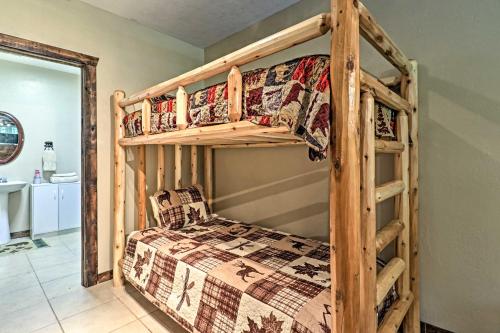 a bedroom with two bunk beds in a room at Beautiful Bryson City Home with Hot Tub and Mtn Views! in Bryson City