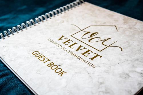 a notebook with the name of a new makeup satisfaction book at 1 Bed House at Velvet Serviced Accommodation Swansea with Free Parking & WiFi - SA1 in Swansea