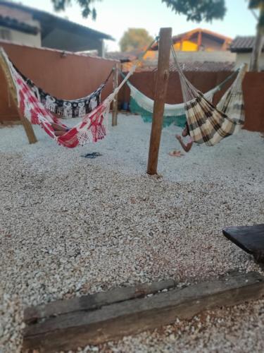 a couple of hammocks hanging in a yard at Pousada Colonial in Pirenópolis