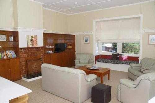 a living room filled with furniture and a fireplace at Amaroo Park in Cowes