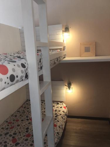 Двухъярусная кровать или двухъярусные кровати в номере Au pied des pistes, Appart 4/6 pers. SUPERDEVOLUY