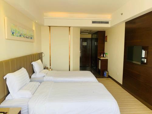 Cama ou camas em um quarto em L Hotels Changsheng Branch
