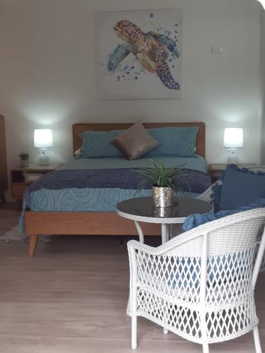A bed or beds in a room at SeaTurtle