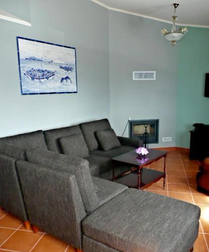 a living room with a couch and a table at Ocean Front Home - Casa Santo Antonio in São Mateus