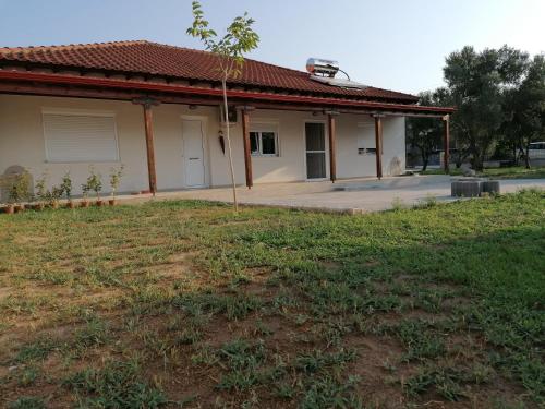 a house with a yard in front of it at Kilkis Paradise in Kilkís