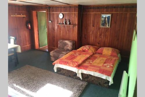 Posteľ alebo postele v izbe v ubytovaní Horská chata v Slovenskom raji