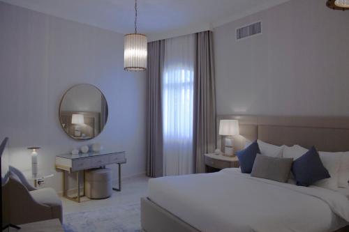 Säng eller sängar i ett rum på Argan Al Bidaa Hotel and Resort , Kuwait