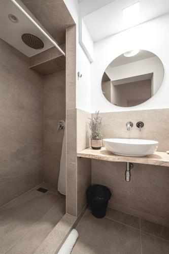 a bathroom with a sink and a mirror at La Finca - Saint Vlas in Sveti Vlas