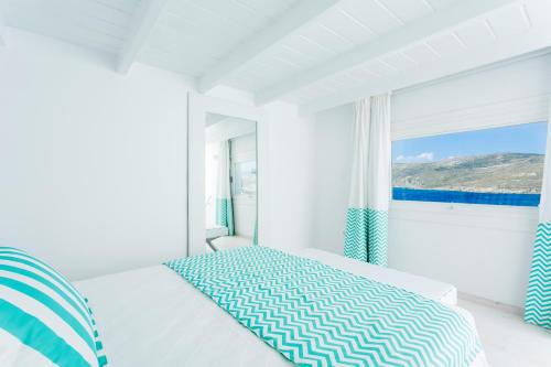Ένα ή περισσότερα κρεβάτια σε δωμάτιο στο Archipelagos Hotel - Small Luxury Hotels of the World
