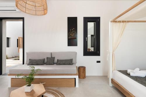 Ένα ή περισσότερα κρεβάτια σε δωμάτιο στο Athina Milos Suites
