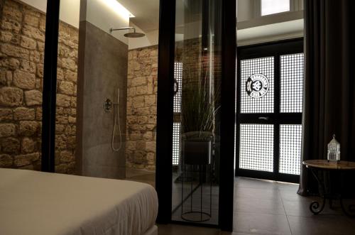 Ένα ή περισσότερα κρεβάτια σε δωμάτιο στο Covo del Carbonaro