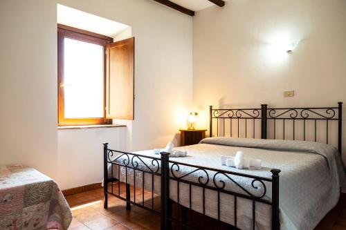 Ένα ή περισσότερα κρεβάτια σε δωμάτιο στο Agriturismo Eden