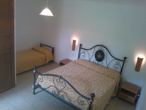 Ένα ή περισσότερα κρεβάτια σε δωμάτιο στο Agriturismo Salento Pietralata