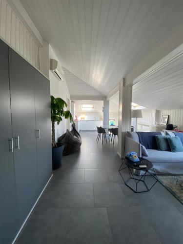 a living room with a bed and a couch at La Garçonniérre del Lago Maggiore in Nebbiuno